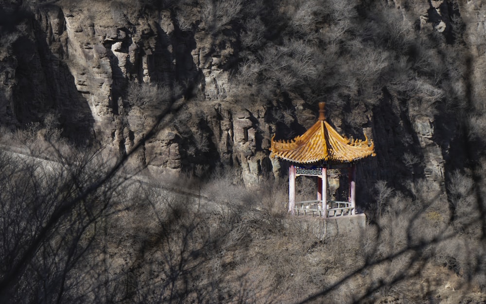 brown and white gazebo on gray mountain