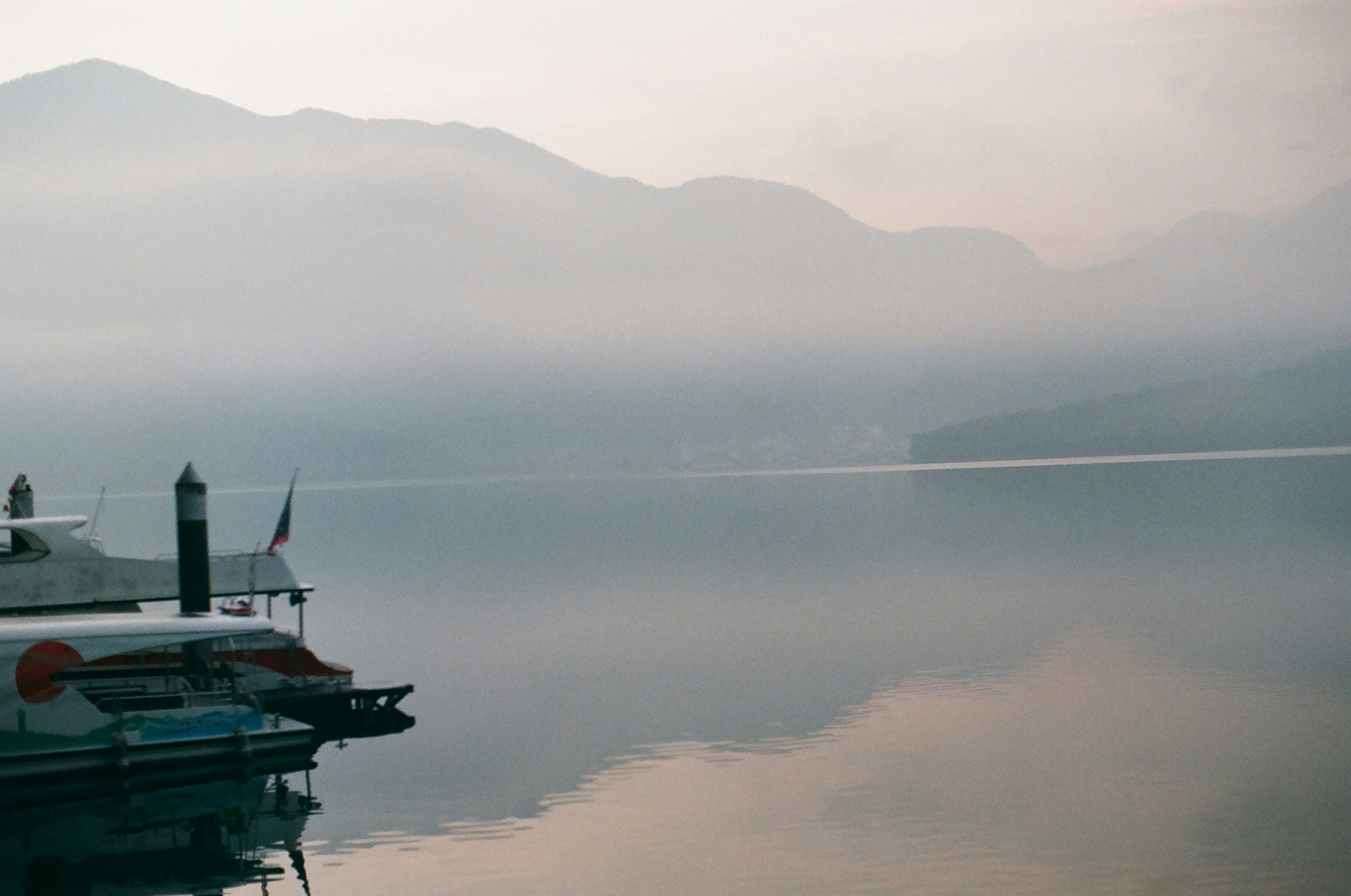 green and white boat on body of water during daytime, 