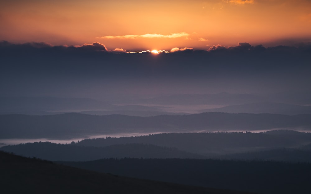 silhouette of mountains during sunset