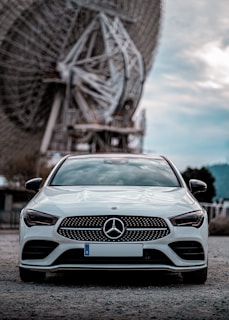 blue mercedes benz car on road during daytime