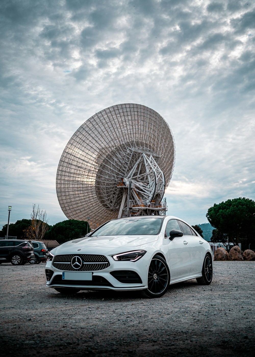 white mercedes benz coupe parked on parking lot during daytime