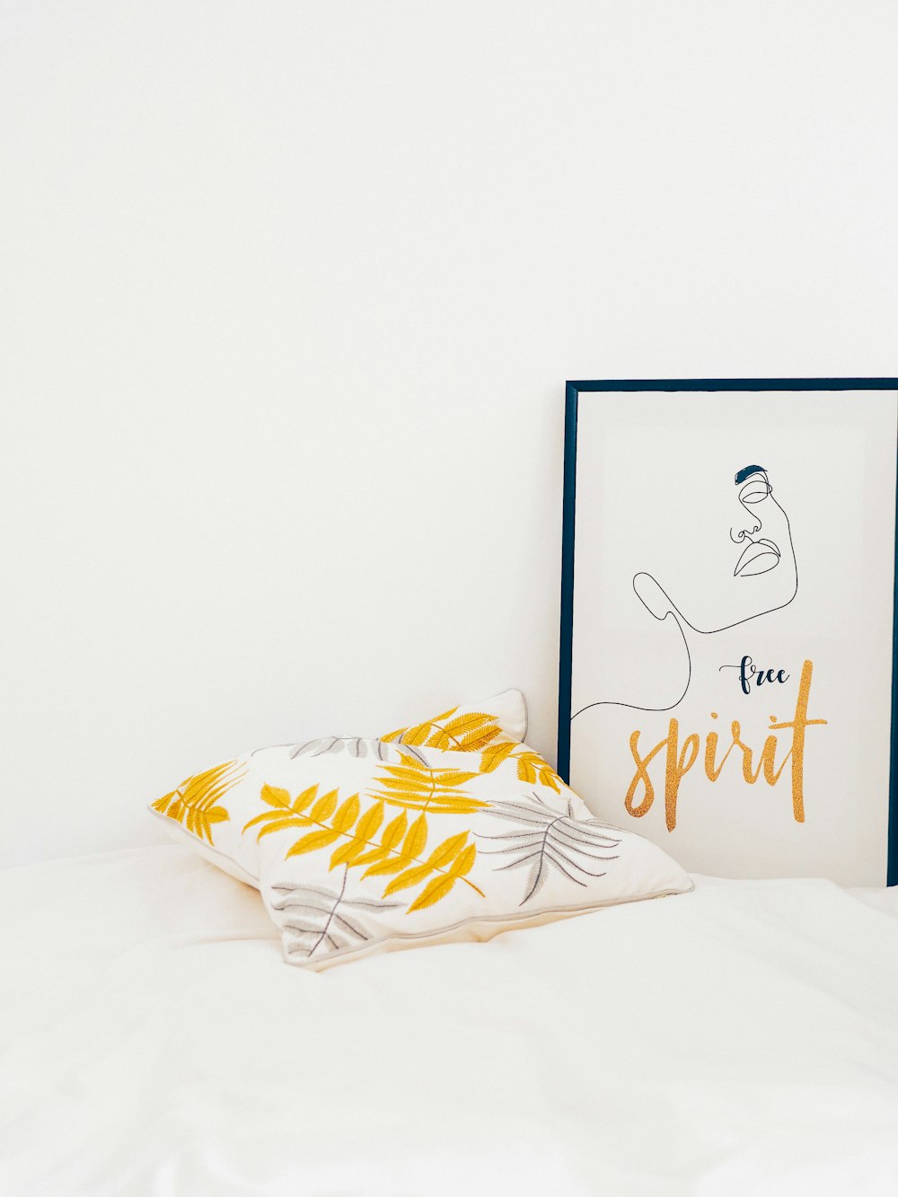 white and yellow throw pillows