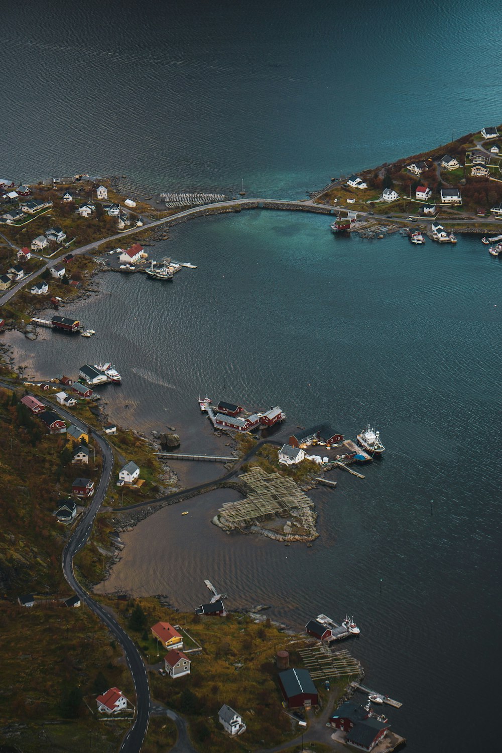 aerial view of white and red boat on water during daytime