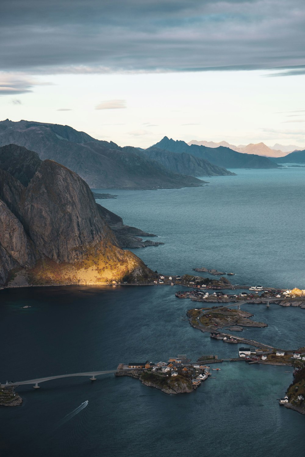 aerial view of body of water near mountain during daytime