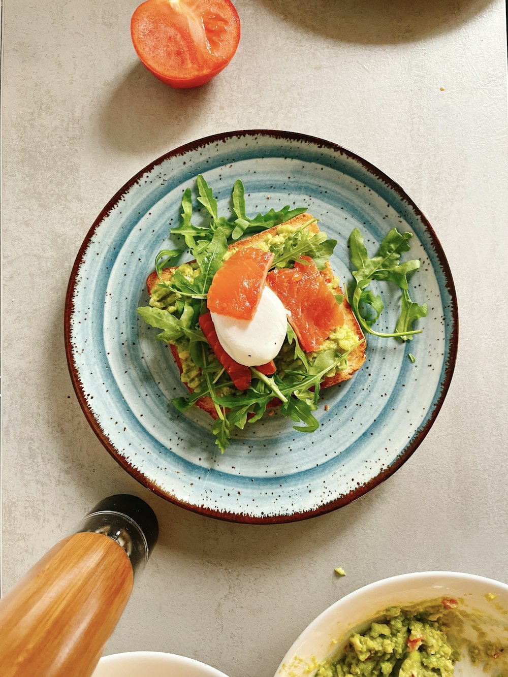 green vegetable on blue and white ceramic plate