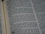 Close-up of a linguist reviewing legal texts on a computer screen.