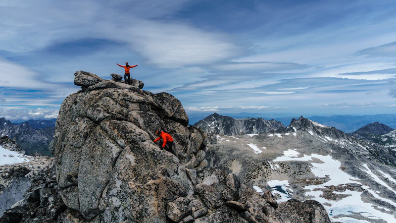 Person sitting on a rock formation