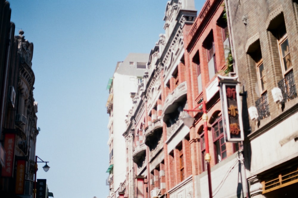 white and red concrete building under blue sky during daytime