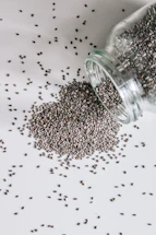 black beads in clear glass jar