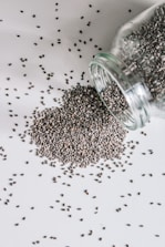 black beads in clear glass jar