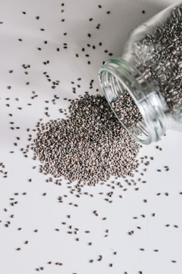black beads in clear glass jar