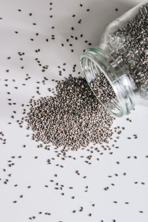 black beads in clear glass jar