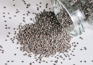 black beads in clear glass jar