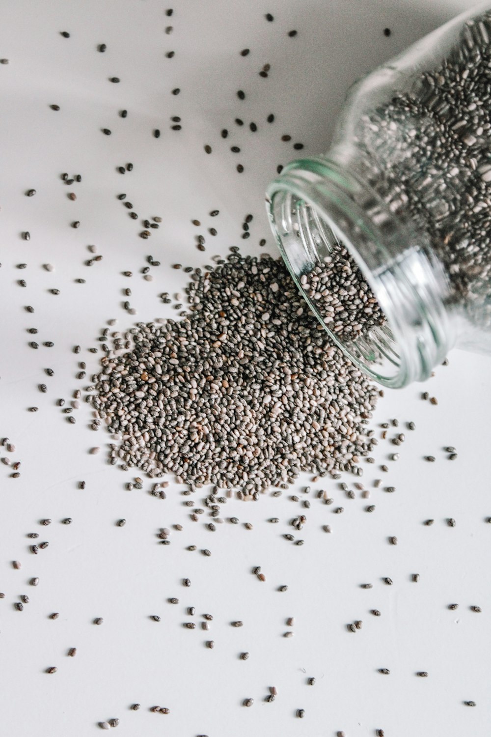 black beads in clear glass jar