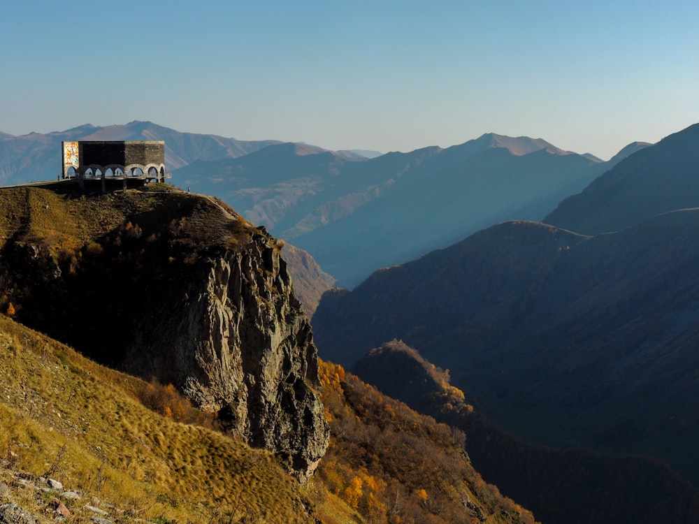 white concrete building on top of mountain during daytime