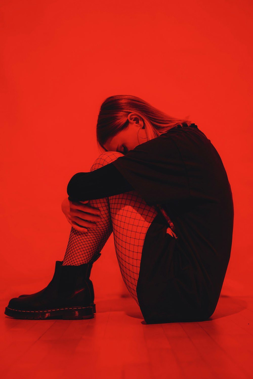 woman in black coat and black and white checkered pants