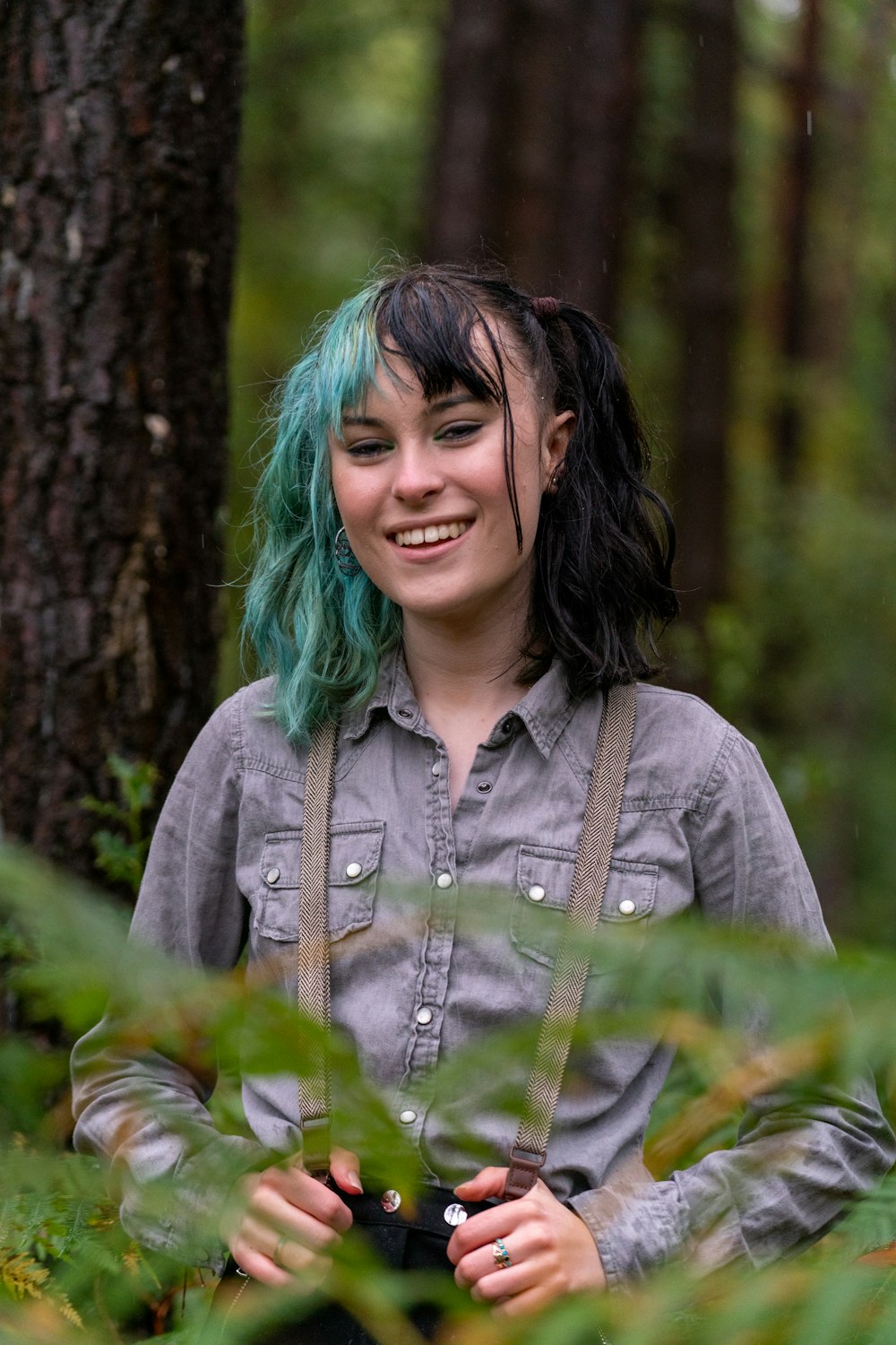 woman in gray button up shirt smiling