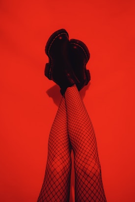 person in black and red plaid pants