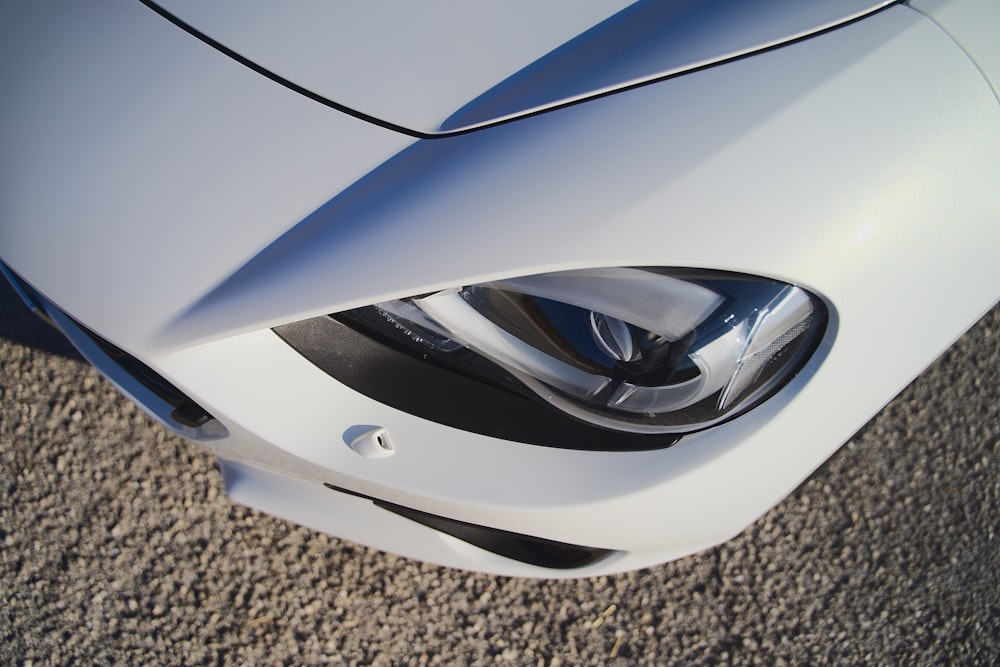 white and silver car on gray carpet