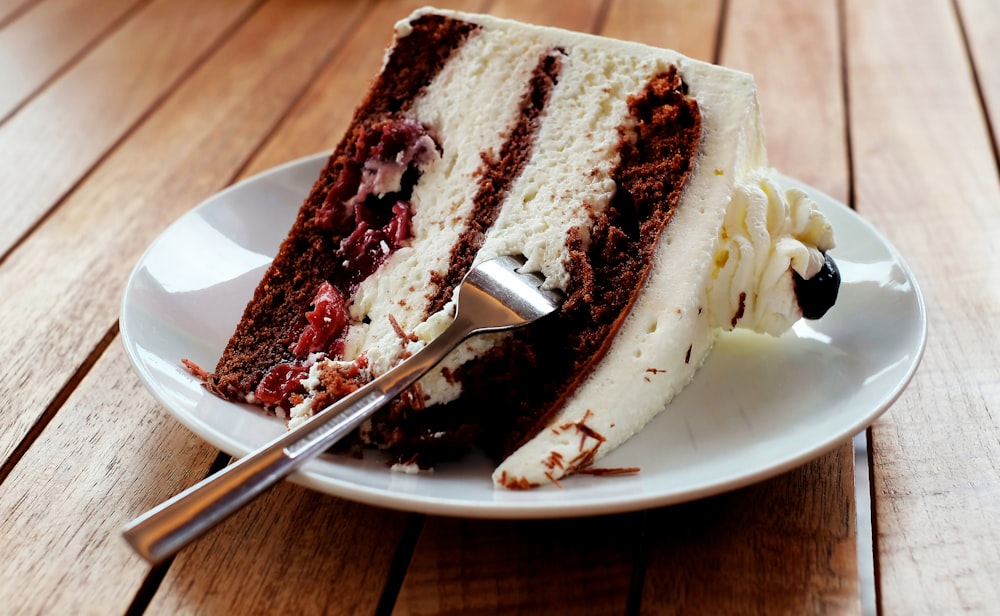 sliced chocolate cake on white ceramic plate