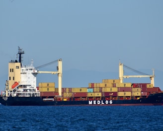 cargo ship on sea during daytime