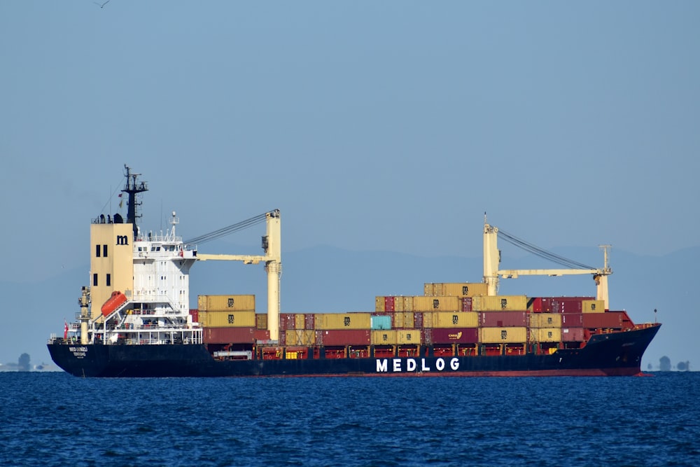 cargo ship on sea during daytime