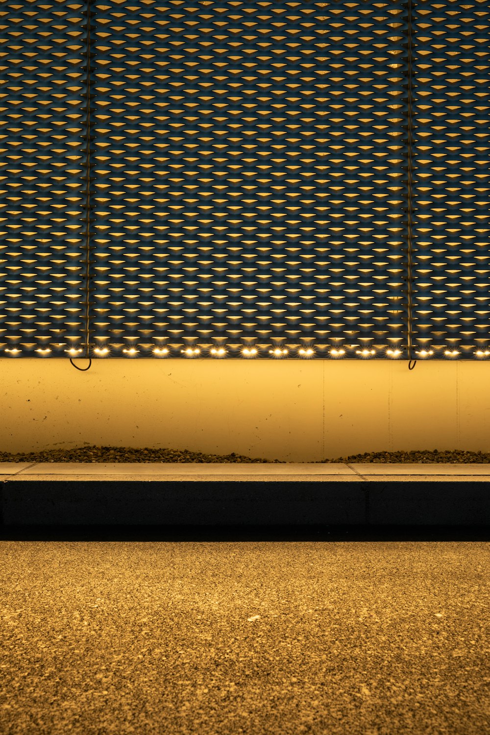 white metal fence on brown sand