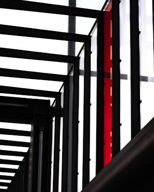Industrial metal framework with a durable, glossy powder coating in bright red.