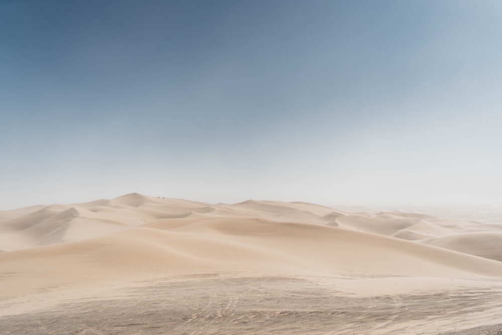 brown sand under blue sky during daytime