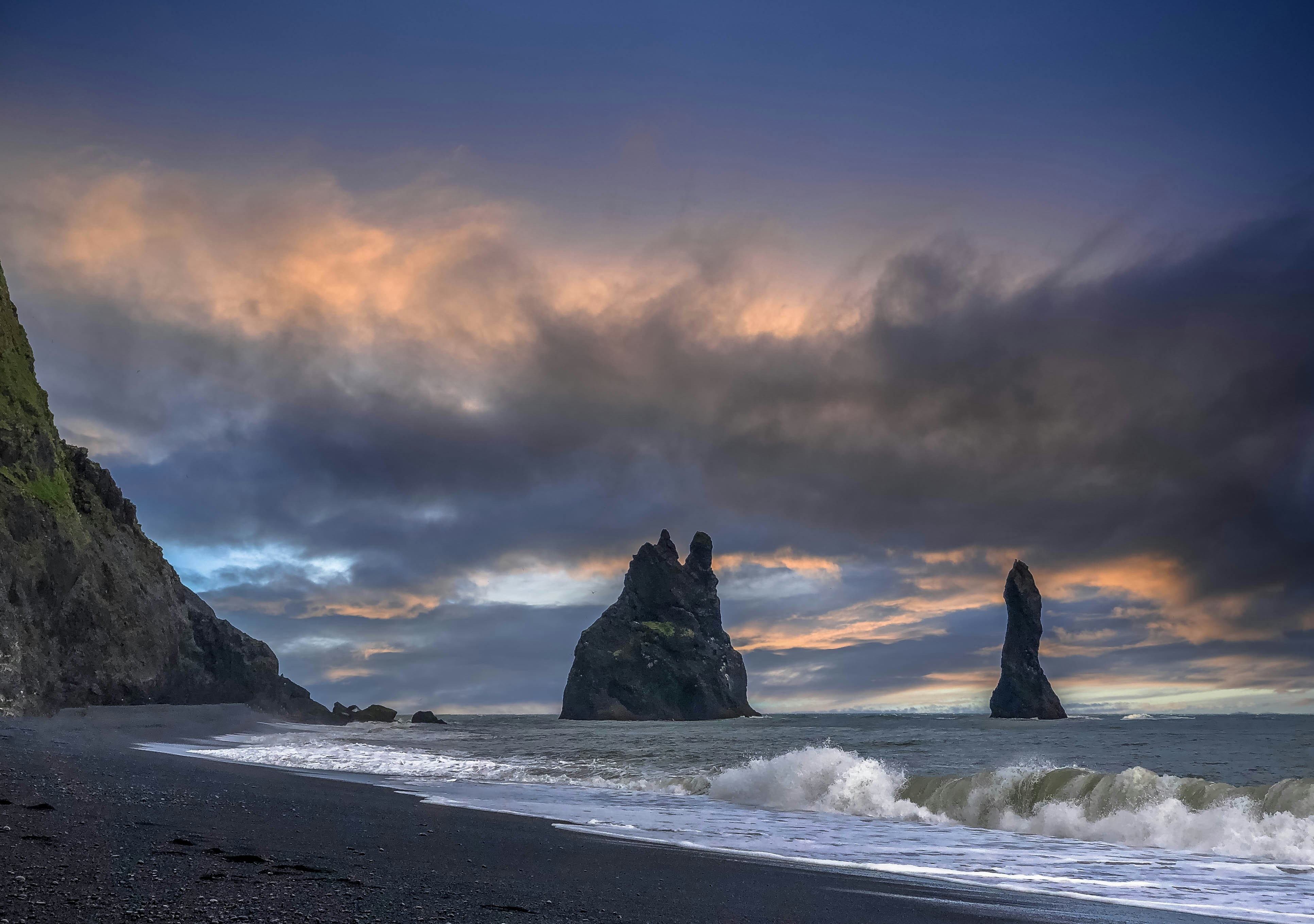 black-rock-formation-on-sea-shore-during-daytime