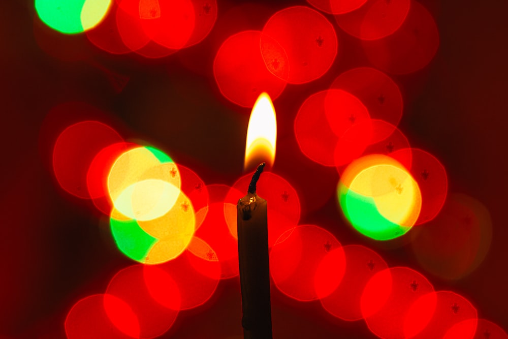 lighted candle in bokeh photography