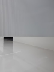 Sleek gray vinyl floor in a commercial space with minimalist furnishings.