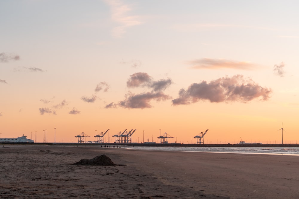 silhouette of people on beach during sunset