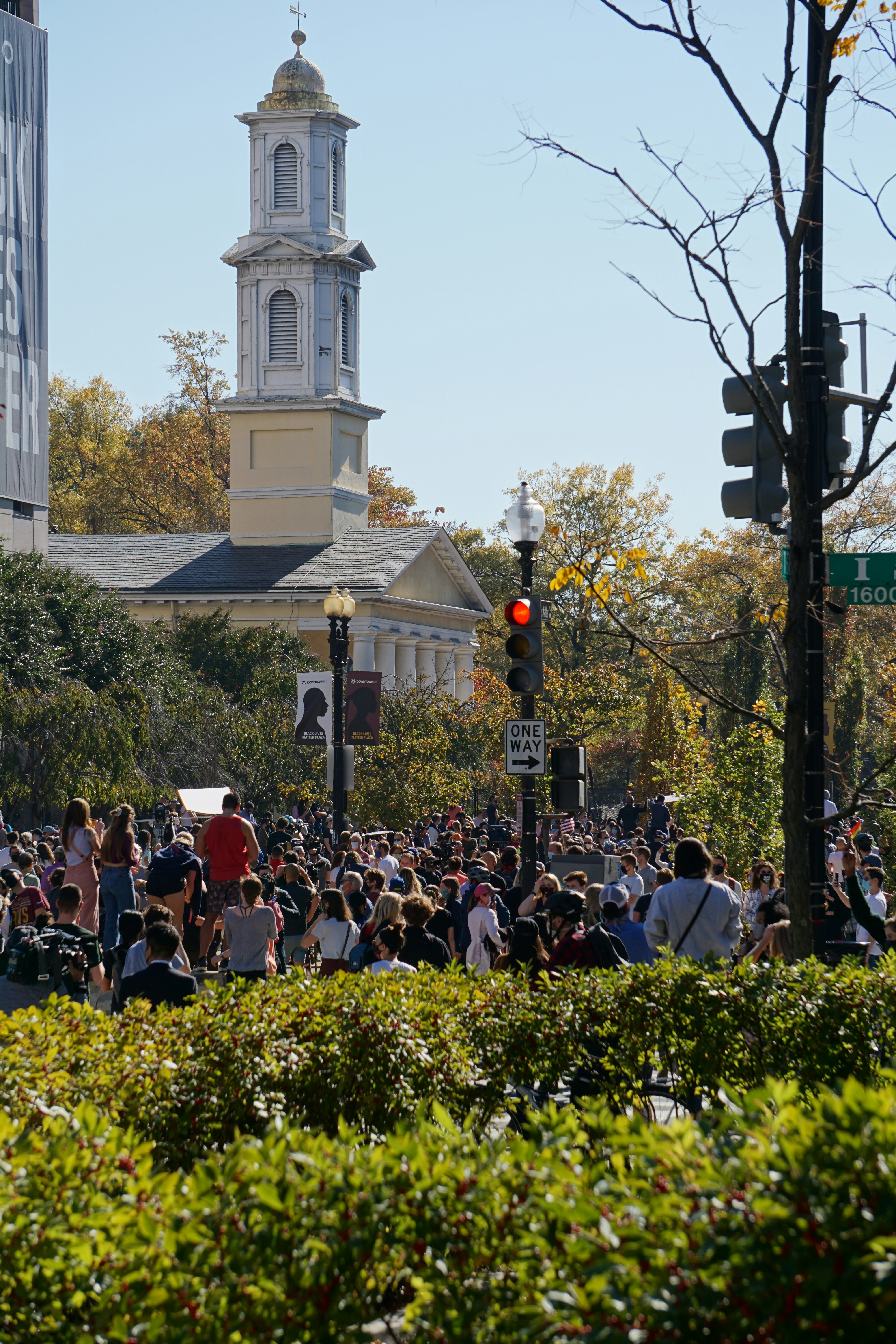 Crowds celebrate the presidential race being called for Joe Biden in front of St. John's Episcopal Church on November 7, 2020.