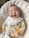 A smiling baby wearing cozy cotton clothes sitting on a soft blanket.