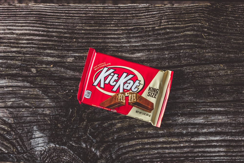 kitkat chocolate pack on black textile