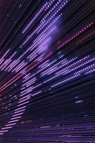 A dynamic scene showing layered parallax grids with violet neon lights and fluid motion effects.