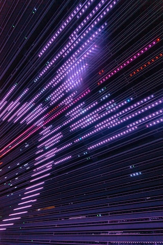 A dynamic scene showing layered parallax grids with violet neon lights and fluid motion effects.
