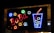 A brightly colored LED sign features the word 'BOBA' in red lights on a black background. To the right, a depiction of a tall drink cup outlined in blue lights with white lights representing ice or bubbles, and a red straw emerging from the top.