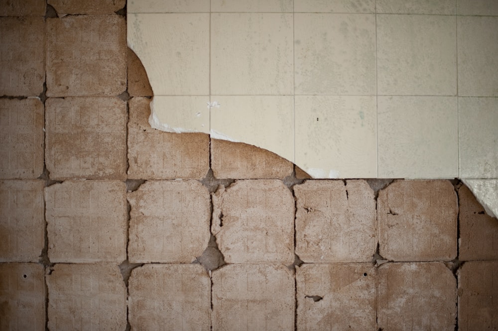 brown concrete blocks on white ceramic tiles