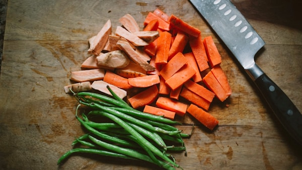 Sliced carrots on chopping board