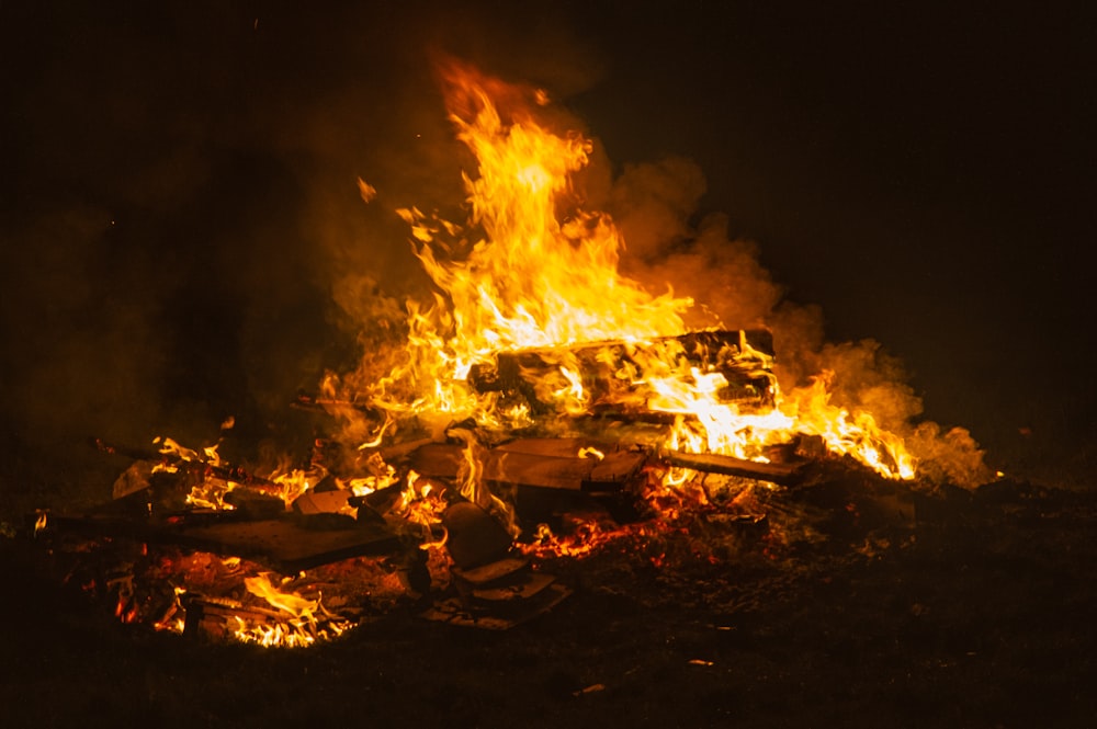 burning firewood on fire during night time