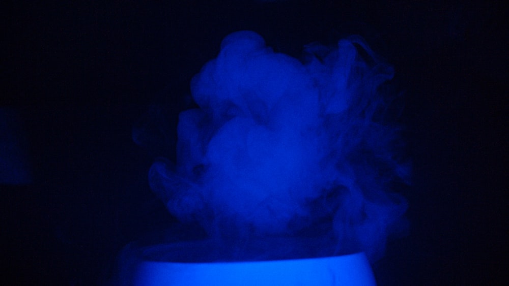 blue smoke in dark room