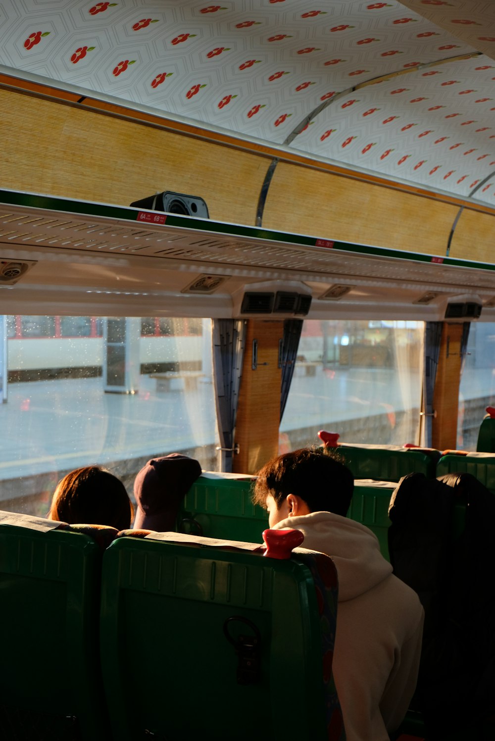 people sitting on green bus seat