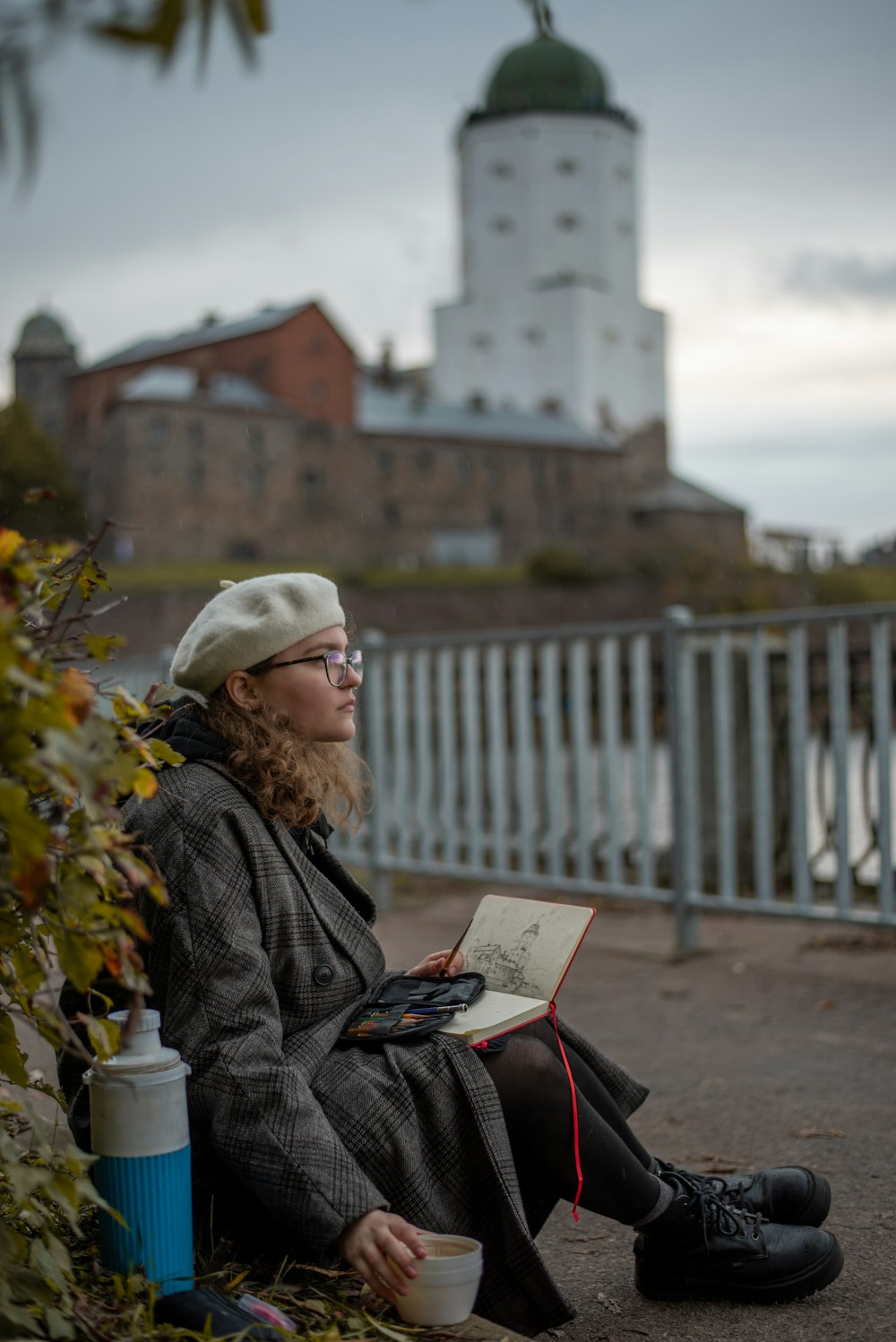 woman in black coat reading book