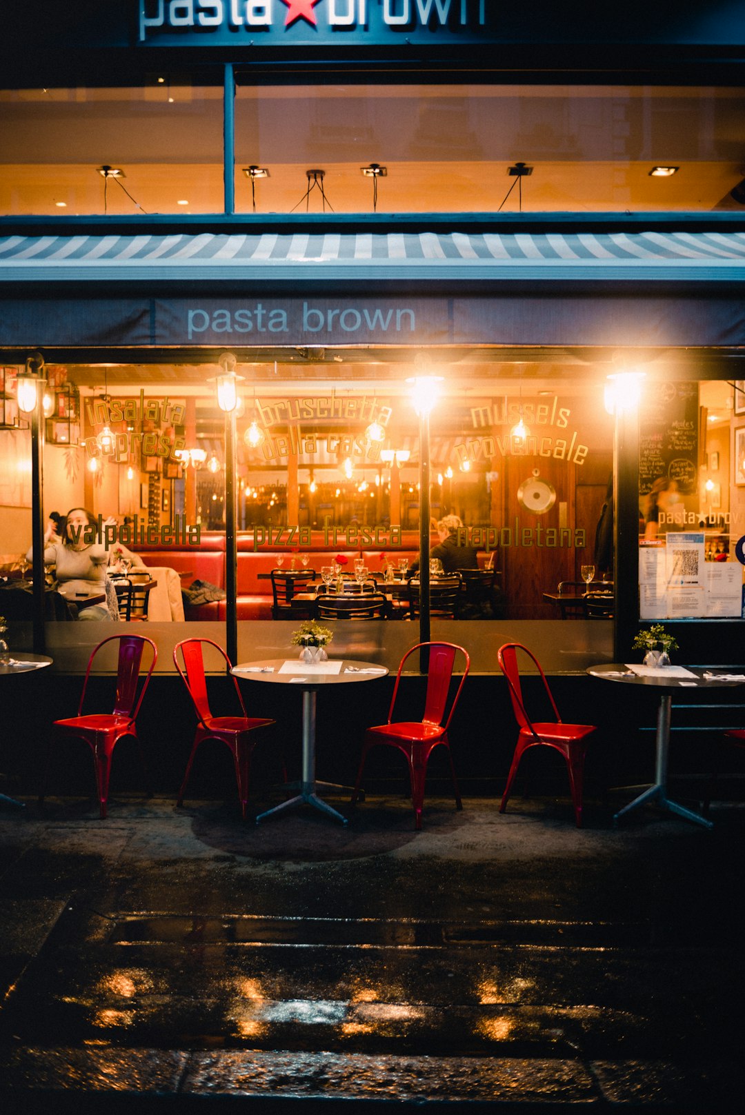 restaurant with red chairs and tables and chairs