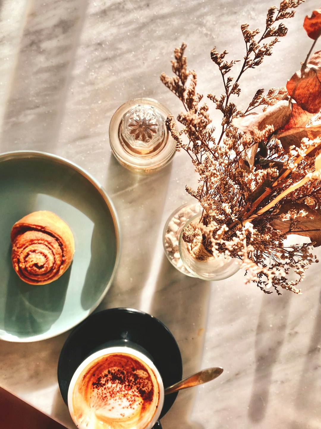 brown and white ceramic cup on saucer