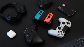 white and orange game controller