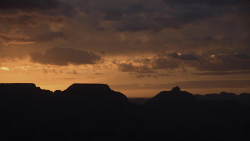 A vibrant sunset over the Colca Canyon with condors soaring in the sky.