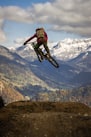 man in red jacket riding motocross dirt bike